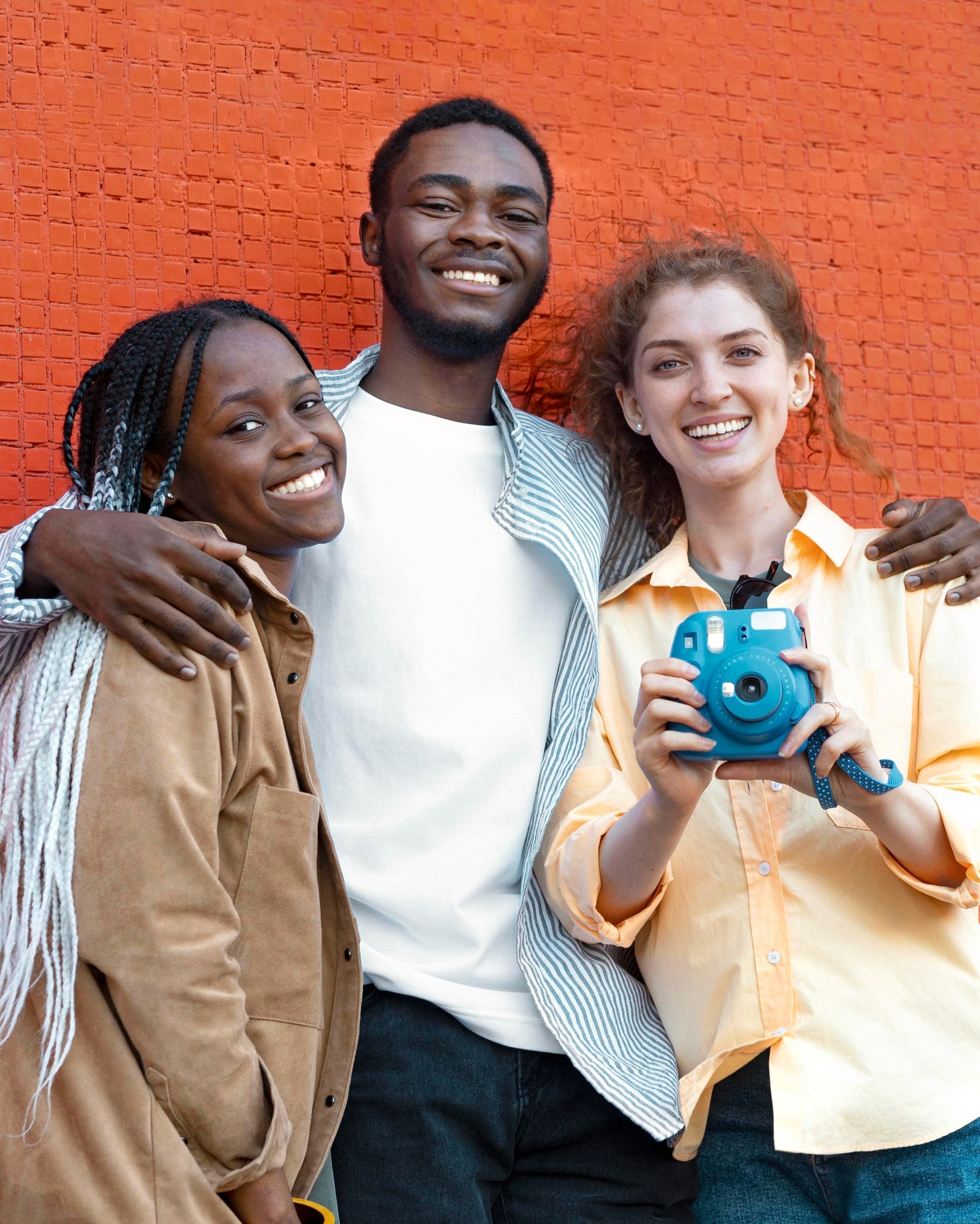 Vision — three friends, one holding a camera