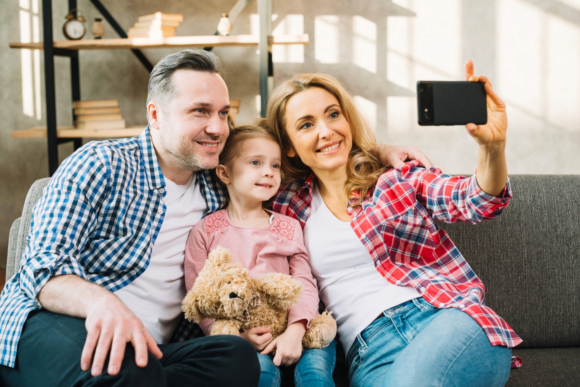Blog — family taking a selfie on couch