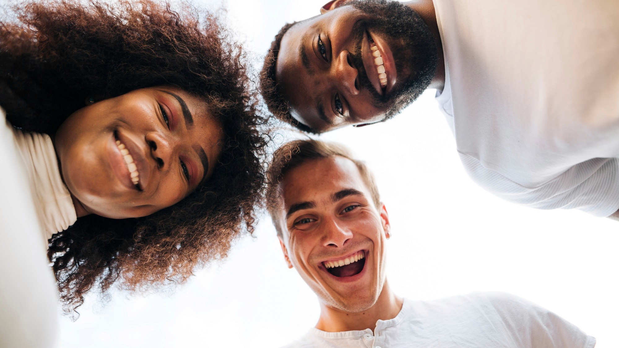 Three smiling people