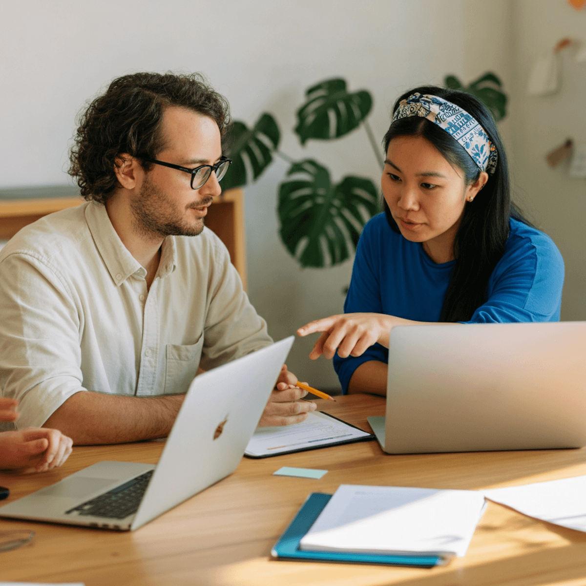 About — two colleagues with laptop